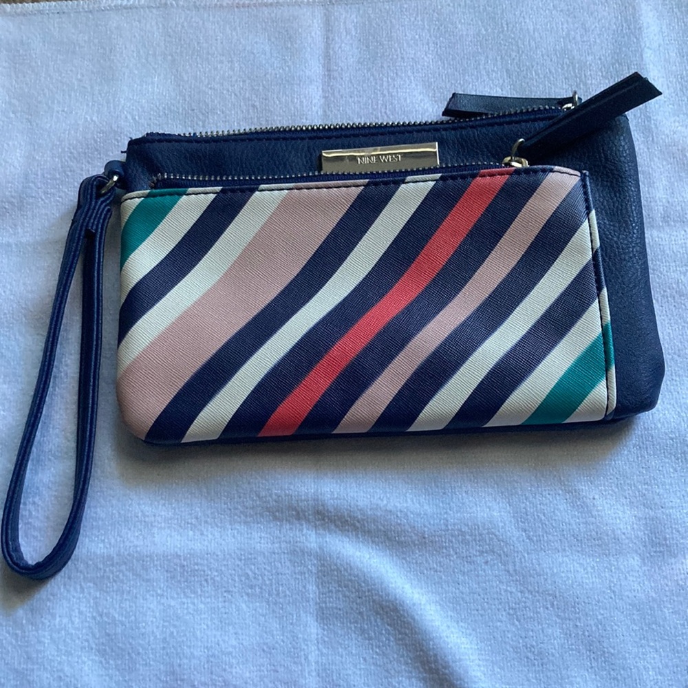 Nine West wristlet with two compartments.